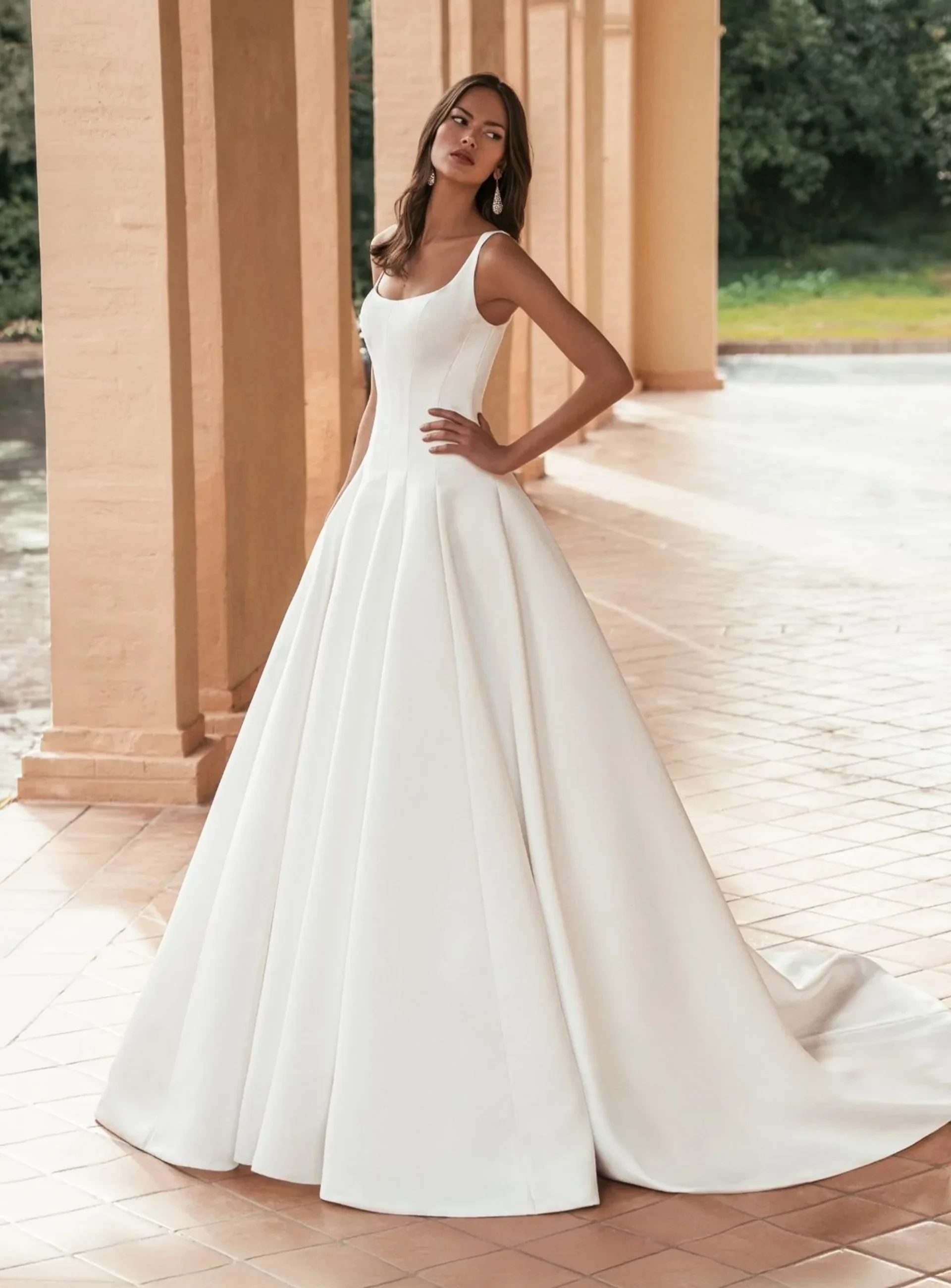 Blue by Enzoani classic satin ball gown with scoop neckline and full skirt.
