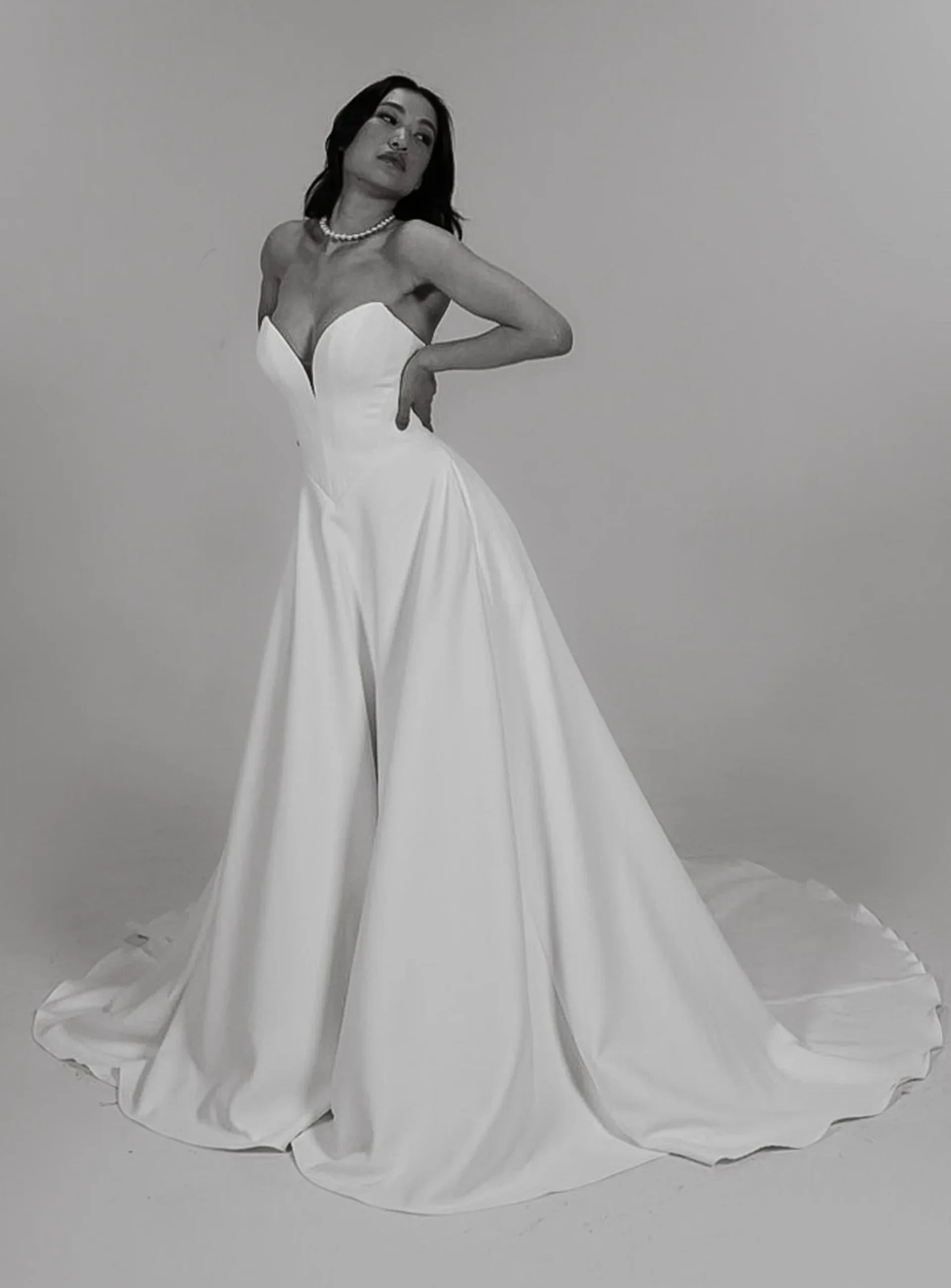Canvas by Colby John strapless ball gown with sculpted sweetheart bodice and train.