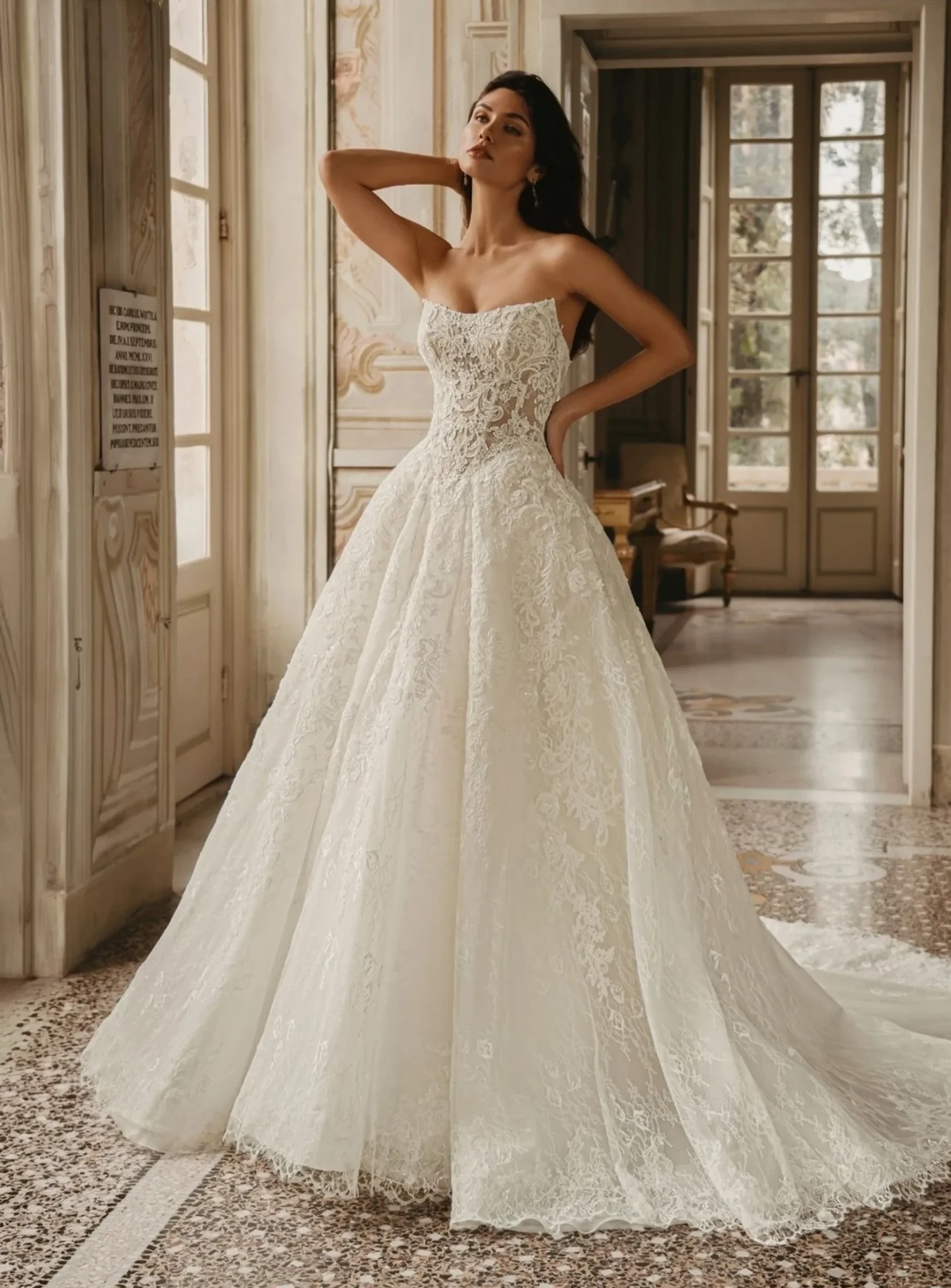 Enzoani lace ball gown with strapless corset bodice and full embroidered skirt.