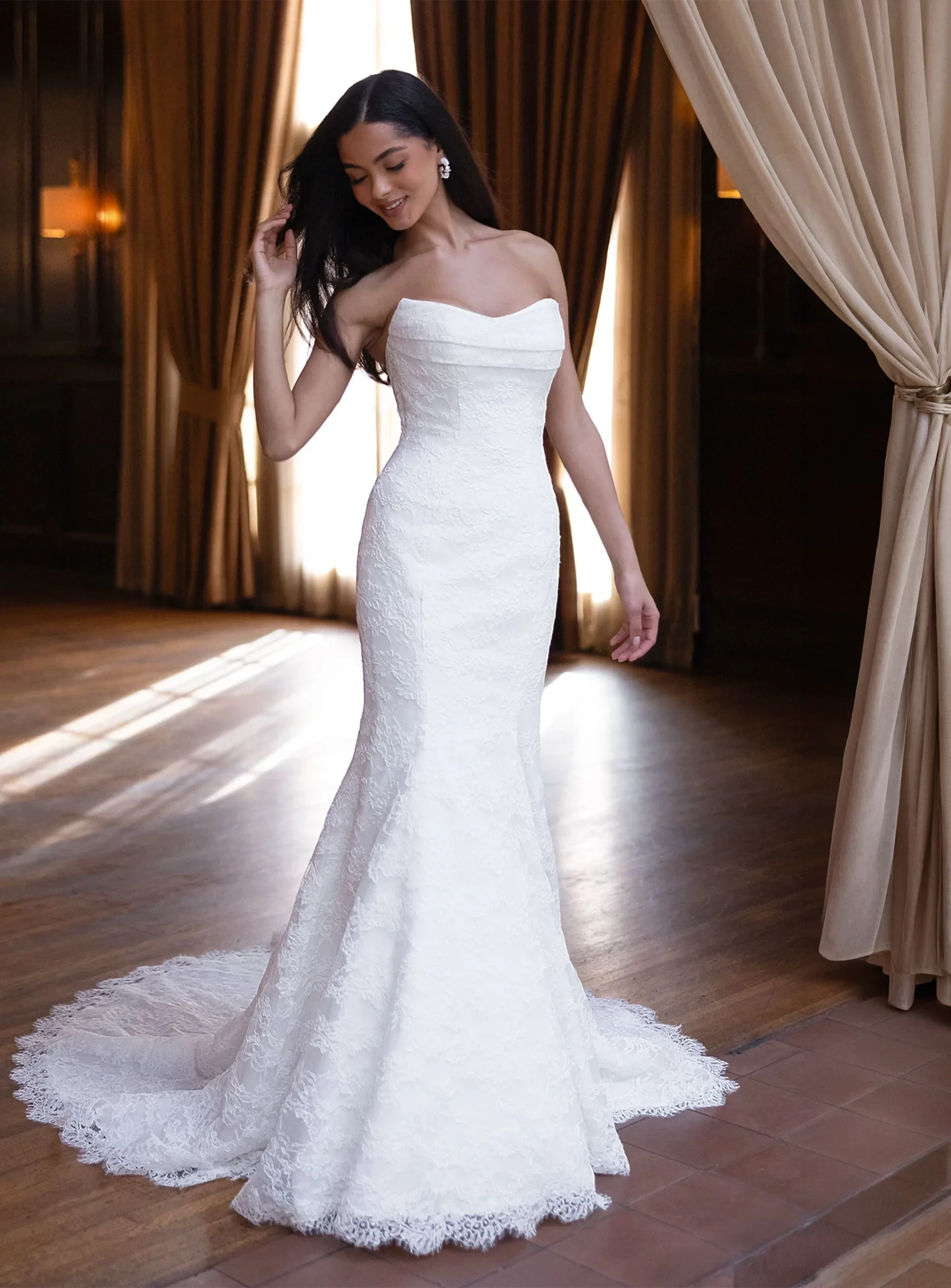 Essense of Australia strapless lace wedding gown with fitted silhouette and train.