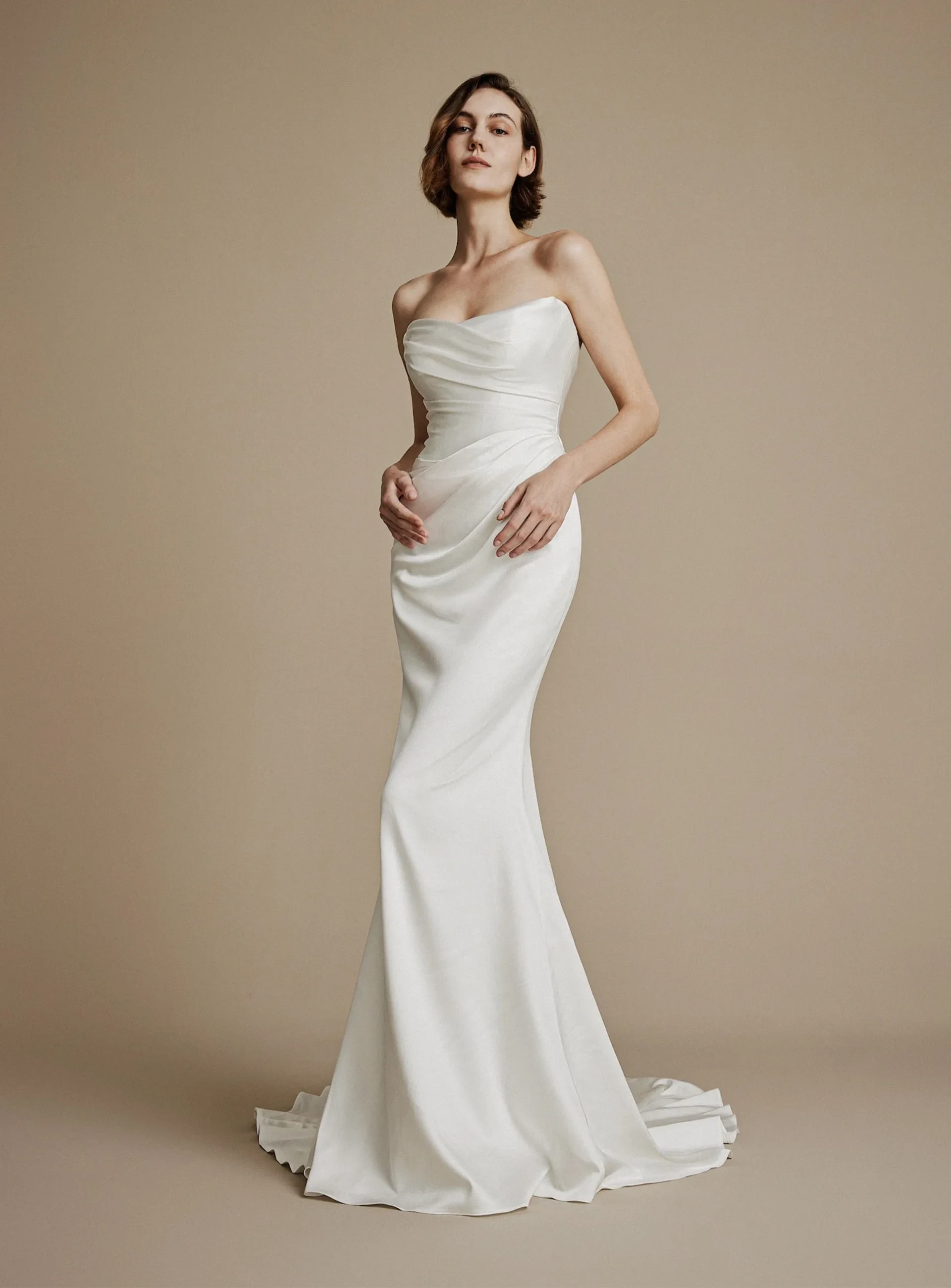 La Premiere fitted strapless wedding gown with softly draped bodice and train.
