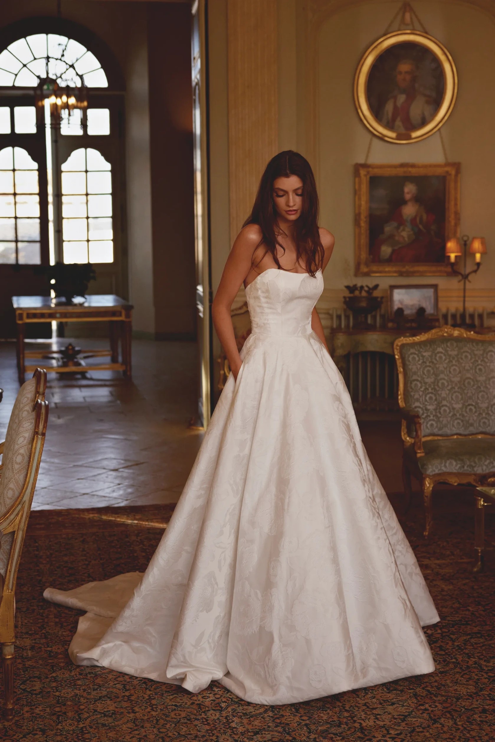 Model wearing a Justin Alexander dress
