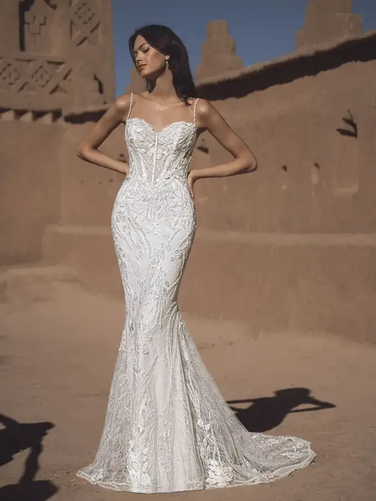 model is wearing a strapless fit and flare bridal gown